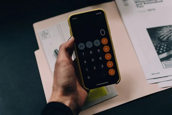 Calculator and financial documents for payroll processing
